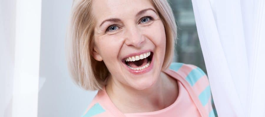 Woman with healthy smile following root canal treatment in Sevierville, TN